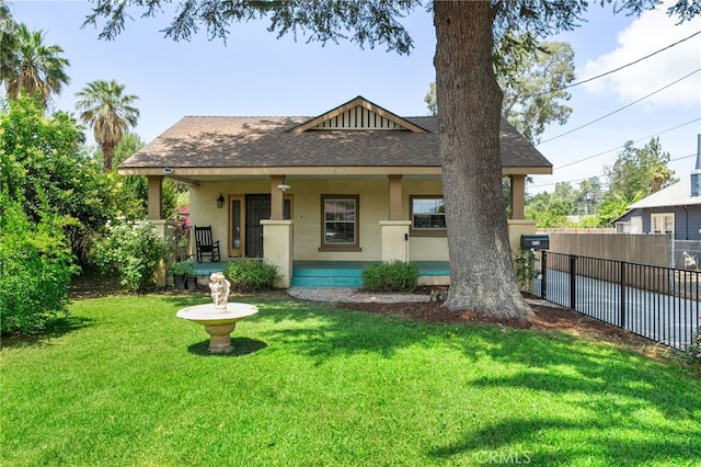 6739 Palm Ave, Riverside, CA 92506 - back of house with stucco siding, covered porch, and roof with shingles