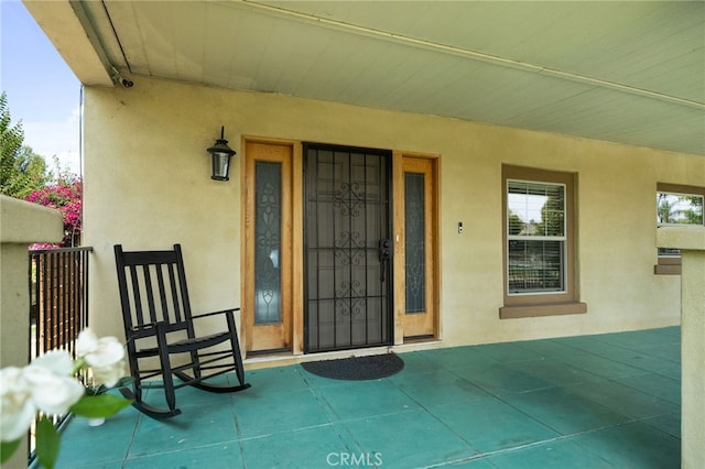 6739 Palm Ave, Riverside, CA 92506 - view of exterior entry with stucco siding and covered porch