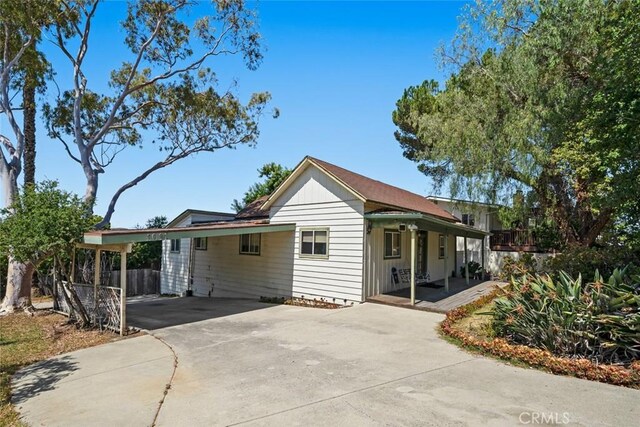 3091 Johnson Ave, San Luis Obispo, CA 93401 - view of front facade featuring driveway, a carport, and covered porch