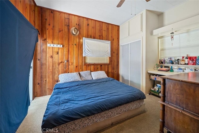 3091 Johnson Ave, San Luis Obispo, CA 93401 - bedroom featuring carpet floors, wood walls, ceiling fan, and a closet