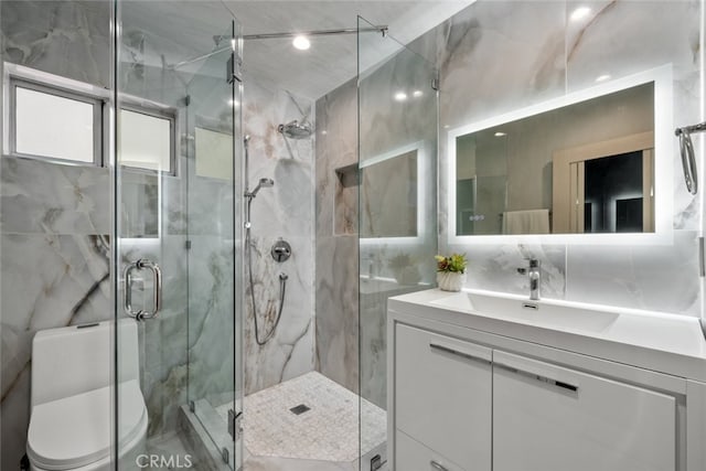6355 Yolanda Ave, Tarzana, CA 91335 - full bathroom featuring tile walls, vanity, and a marble finish shower
