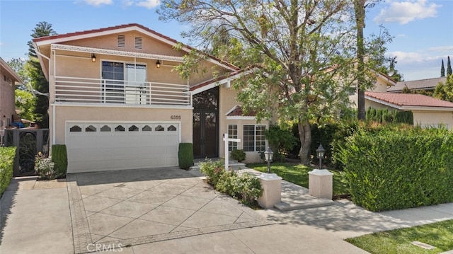 6355 Yolanda Ave, Tarzana, CA 91335 - view of front of property featuring stucco siding, concrete driveway, and a garage