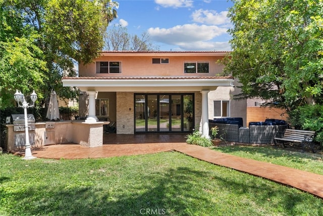 6355 Yolanda Ave, Tarzana, CA 91335 - rear view of house with an outdoor kitchen, a yard, a patio area, stucco siding, and an outdoor living space
