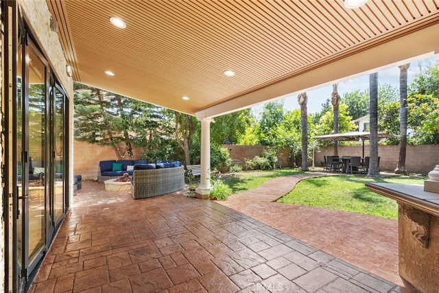 6355 Yolanda Ave, Tarzana, CA 91335 - fenced backyard featuring an outdoor living space with a fire pit and a patio area