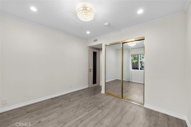 6355 Yolanda Ave, Tarzana, CA 91335 - unfurnished bedroom featuring a chandelier, wood finished floors, a closet, ornamental molding, and recessed lighting