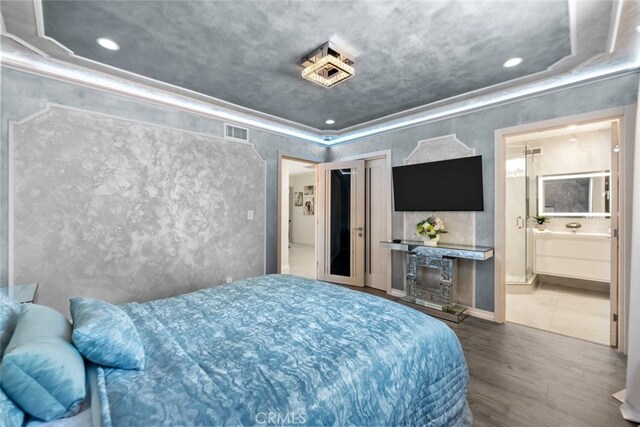 6355 Yolanda Ave, Tarzana, CA 91335 - bedroom featuring wood finished floors, ornamental molding, recessed lighting, and ensuite bath