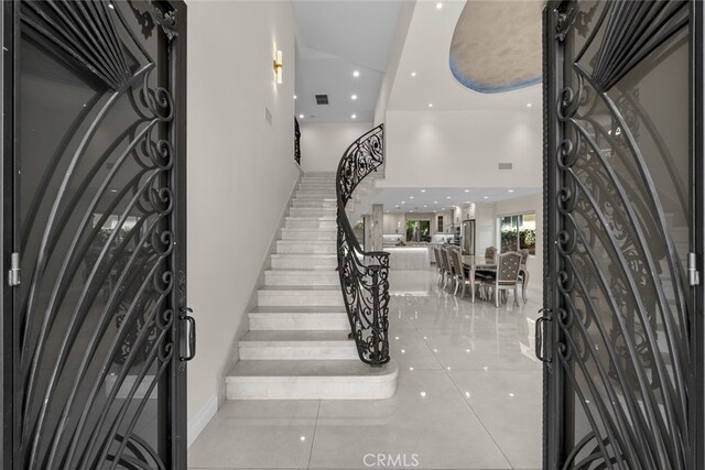 6355 Yolanda Ave, Tarzana, CA 91335 - foyer entrance with stairway, a towering ceiling, tile patterned flooring, and recessed lighting