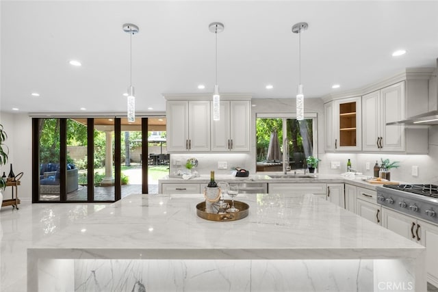 6355 Yolanda Ave, Tarzana, CA 91335 - kitchen featuring light stone counters, recessed lighting, appliances with stainless steel finishes, white cabinetry, and glass insert cabinets