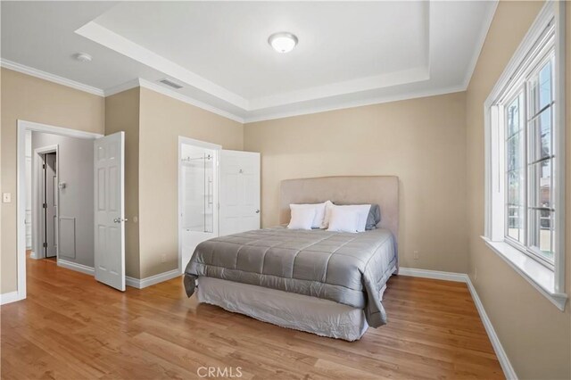 18651 E Weather Rd, Covina, CA 91722 - bedroom with a tray ceiling, wood finished floors, and ensuite bathroom