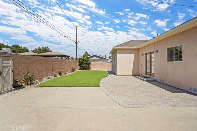 18651 E Weather Rd, Covina, CA 91722 - fenced backyard with french doors and a patio