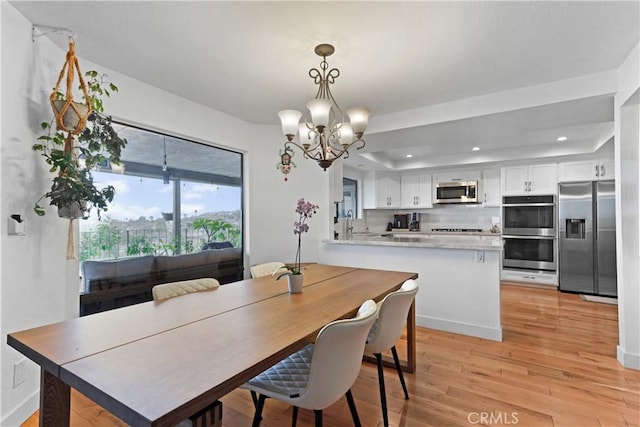 1995 Molino Ave Unit 102, Signal Hill, CA 90755 - dining space with a chandelier, light wood-type flooring, recessed lighting, and a tray ceiling