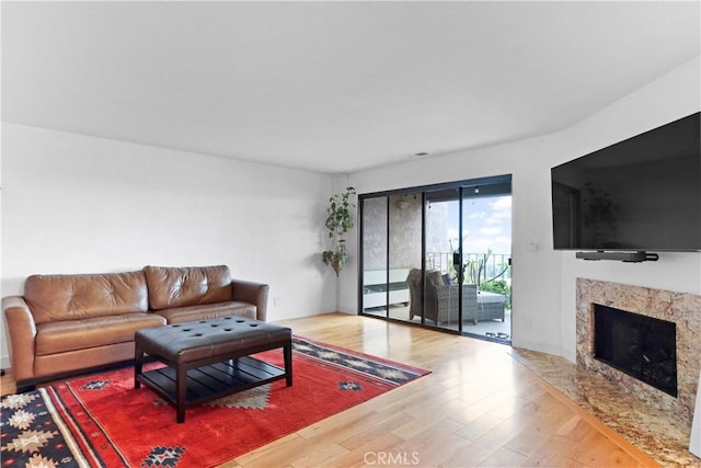 1995 Molino Ave Unit 102, Signal Hill, CA 90755 - living area featuring wood finished floors and a premium fireplace