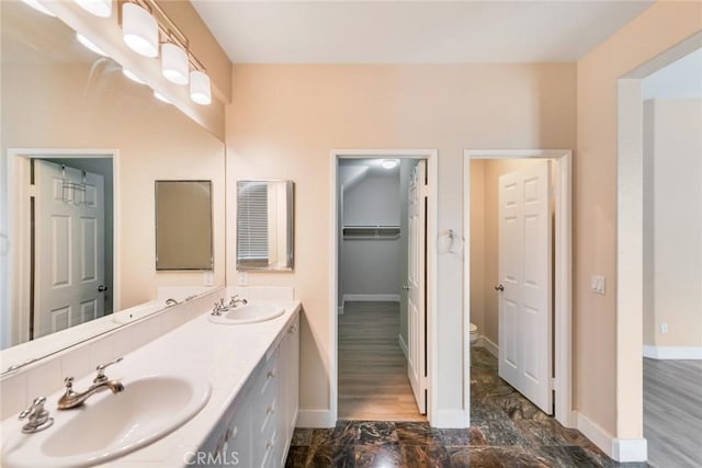 13711 Hidden, Eastvale, CA 92880 - full bathroom featuring double vanity and baseboards