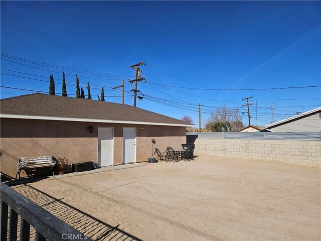 45019 Division St Unit 101, Lancaster, CA 93535 - rear view of house featuring stucco siding and a patio