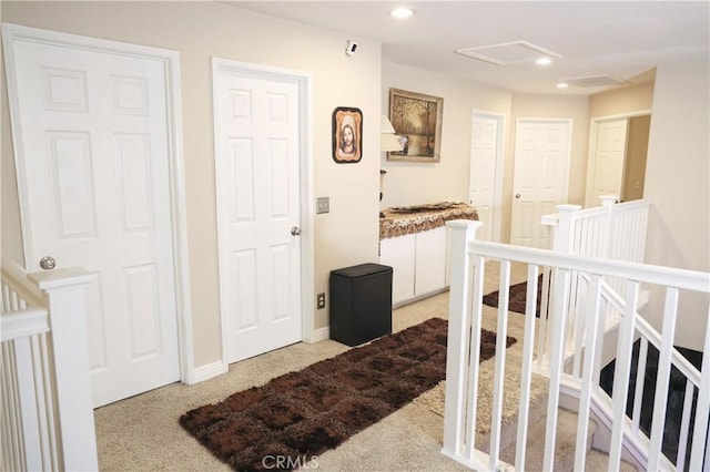 12170 Orgren Ave, Chino, CA 91710 - corridor with light colored carpet, an upstairs landing, attic access, and recessed lighting