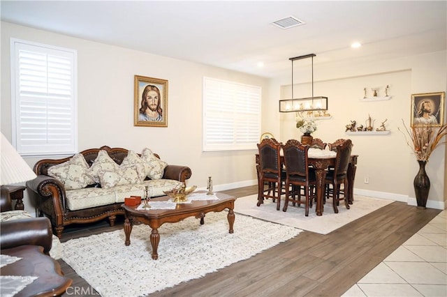 12170 Orgren Ave, Chino, CA 91710 - living area featuring a chandelier, wood finished floors, and recessed lighting
