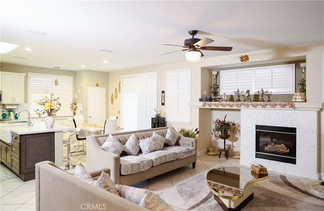 12170 Orgren Ave, Chino, CA 91710 - living area with light tile patterned floors, ceiling fan, a fireplace, and recessed lighting