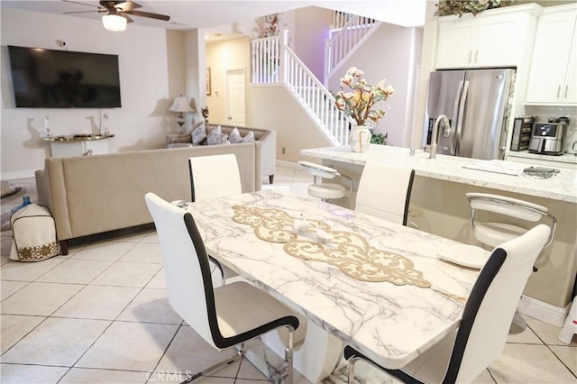 12170 Orgren Ave, Chino, CA 91710 - dining room featuring stairs, ceiling fan, and light tile patterned floors
