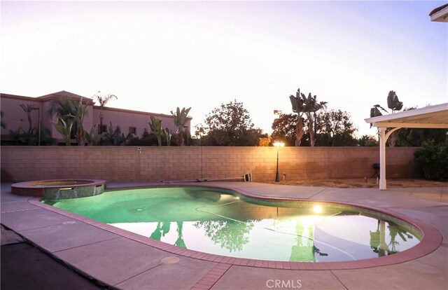 12170 Orgren Ave, Chino, CA 91710 - view of pool featuring a fenced backyard, a pool with connected hot tub, and a patio