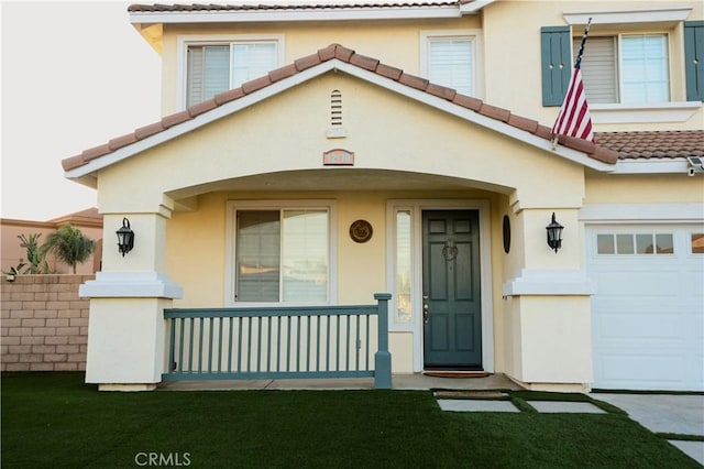12170 Orgren Ave, Chino, CA 91710 - view of front of home featuring a tile roof, stucco siding, an attached garage, and a porch