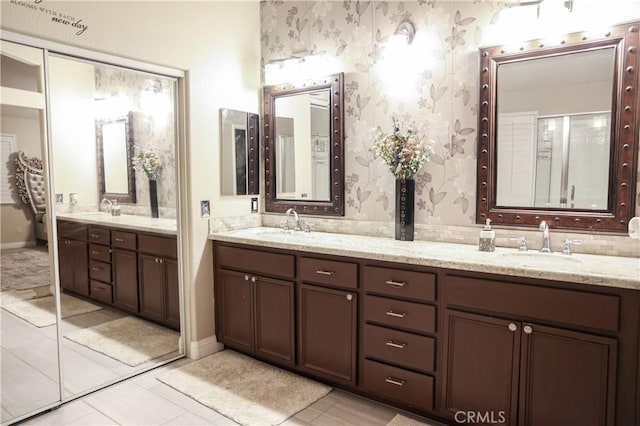 12170 Orgren Ave, Chino, CA 91710 - bathroom featuring double vanity, wallpapered walls, and tile patterned floors