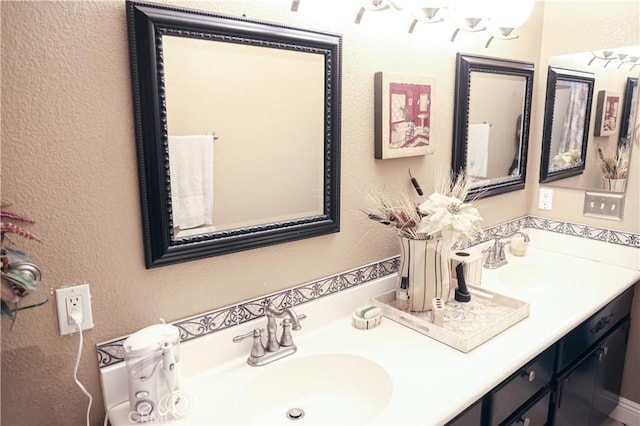 12170 Orgren Ave, Chino, CA 91710 - bathroom with double vanity and a textured wall