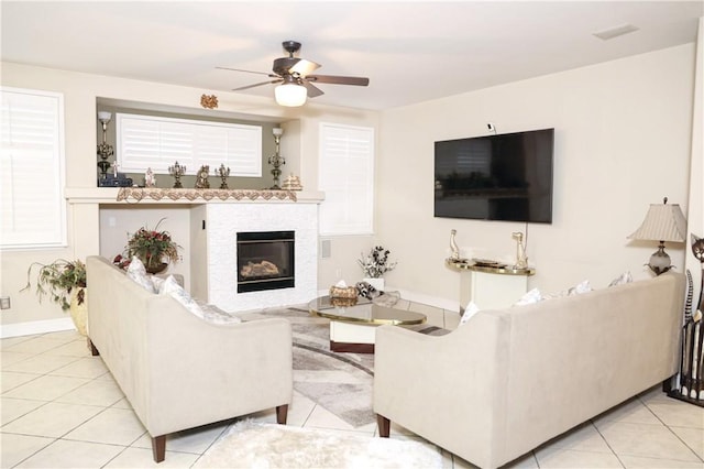 12170 Orgren Ave, Chino, CA 91710 - living area featuring ceiling fan, a glass covered fireplace, and tile patterned floors
