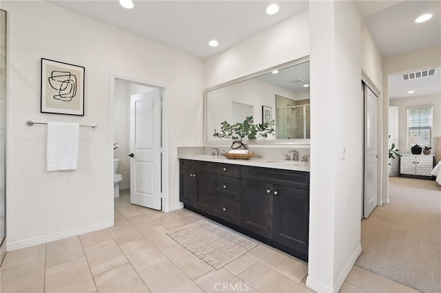 143 Hollow Tree, Irvine, CA 92618 - full bath with a shower stall, double vanity, ensuite bath, recessed lighting, and tile patterned floors