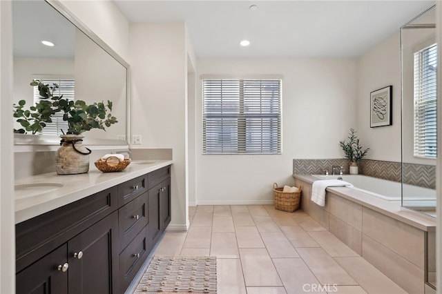 143 Hollow Tree, Irvine, CA 92618 - bathroom featuring double vanity, tile patterned floors, a bath, and recessed lighting