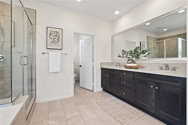143 Hollow Tree, Irvine, CA 92618 - bathroom featuring double vanity, a shower stall, tile patterned flooring, and recessed lighting