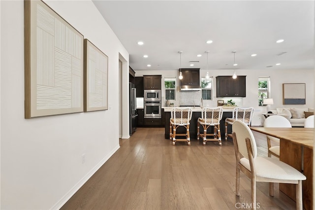 143 Hollow Tree, Irvine, CA 92618 - dining area with wood finished floors and recessed lighting