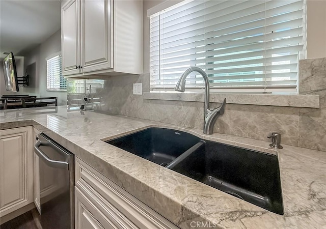 2288 Marilyn St, Simi Valley, CA 93065 - kitchen featuring dishwasher, backsplash, light stone countertops, and white cabinets