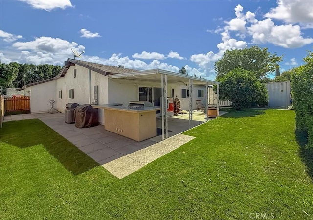 2288 Marilyn St, Simi Valley, CA 93065 - back of property with a patio area, area for grilling, stucco siding, and a bar