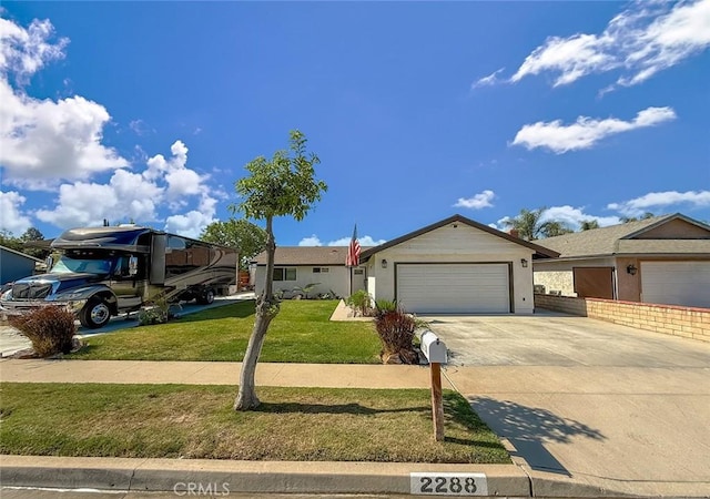 2288 Marilyn St, Simi Valley, CA 93065 - single story home featuring an attached garage, a front yard, and concrete driveway