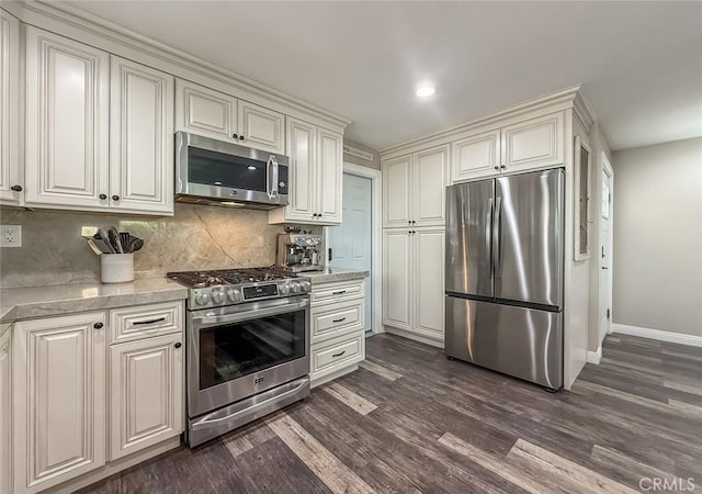 2288 Marilyn St, Simi Valley, CA 93065 - kitchen featuring stainless steel appliances, light countertops, dark wood-style flooring, tasteful backsplash, and recessed lighting