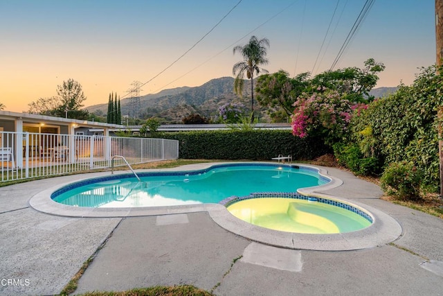 328 Bettyhill Ave, Duarte, CA 91010 - pool at dusk with a pool with connected hot tub, a mountain view, a patio, and a diving board