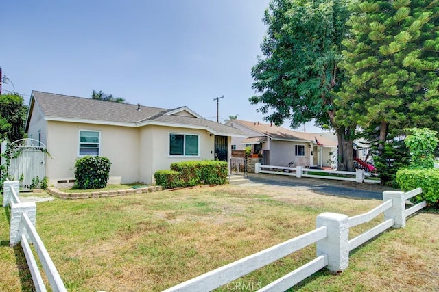 12029 Greyford St, Whittier, CA 90606 - ranch-style house with stucco siding, a shingled roof, and a gate