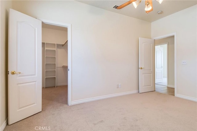 11471 Azure View Rd, Pinon Hills, CA 92372 - unfurnished bedroom with carpet, a spacious closet, a closet, and a ceiling fan