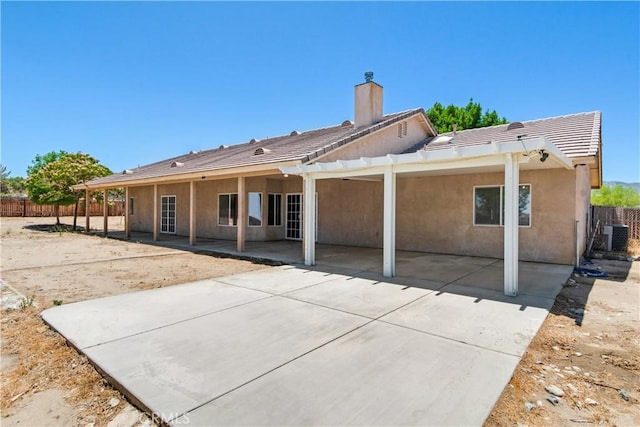 11471 Azure View Rd, Pinon Hills, CA 92372 - back of house with a chimney, stucco siding, a patio area, and a tile roof