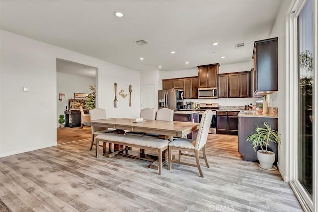 2146 N Rinaldi Ct, Visalia, CA 93291 - dining area featuring light wood-type flooring and recessed lighting