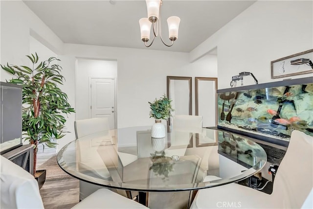2146 N Rinaldi Ct, Visalia, CA 93291 - dining area featuring a chandelier and wood finished floors