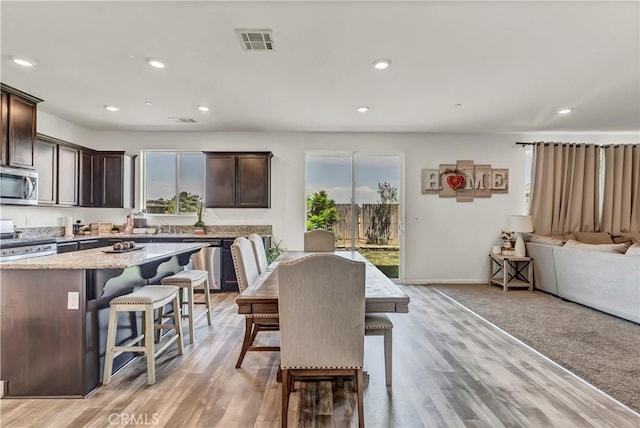 2146 N Rinaldi Ct, Visalia, CA 93291 - dining area with light wood-style flooring and recessed lighting