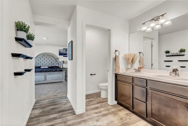 2146 N Rinaldi Ct, Visalia, CA 93291 - full bathroom with ensuite bath, double vanity, and wood finished floors