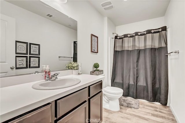2146 N Rinaldi Ct, Visalia, CA 93291 - full bath with vanity, wood finished floors, and a shower with shower curtain