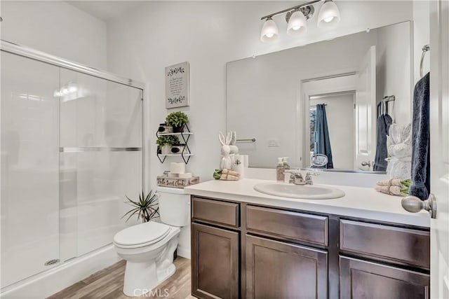 2146 N Rinaldi Ct, Visalia, CA 93291 - full bath with vanity, a shower stall, and wood finished floors