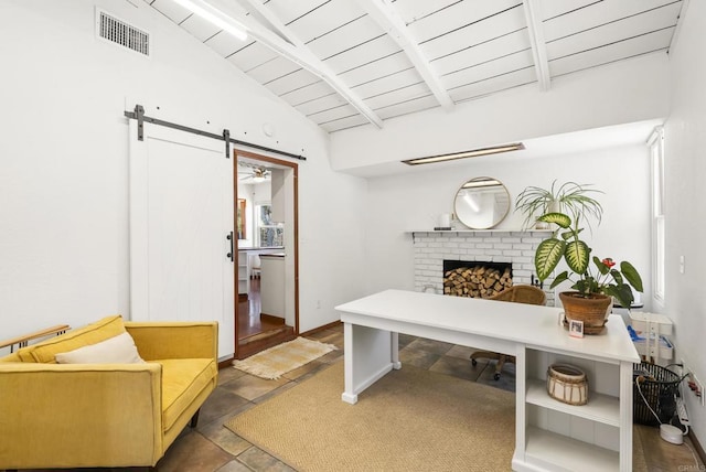 205 C St, Chula Vista, CA 91910 - home office featuring wooden ceiling, a fireplace, stone finish floors, and a barn door