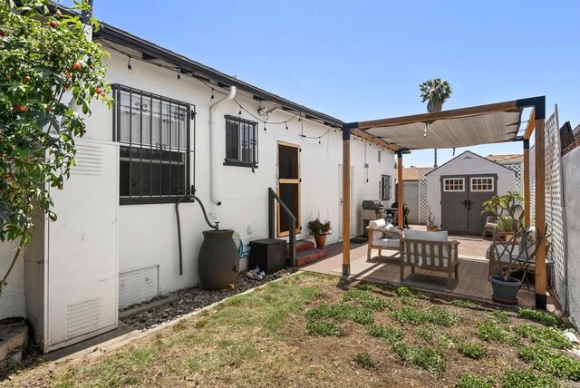 205 C St, Chula Vista, CA 91910 - view of yard with a storage unit and a patio