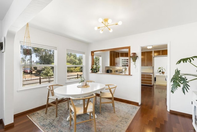 205 C St, Chula Vista, CA 91910 - dining space featuring a chandelier and dark wood-style flooring