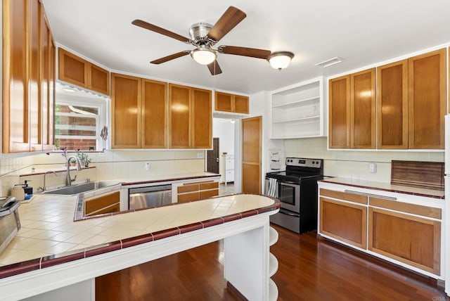 205 C St, Chula Vista, CA 91910 - kitchen featuring stainless steel appliances, open shelves, tile counters, and tasteful backsplash