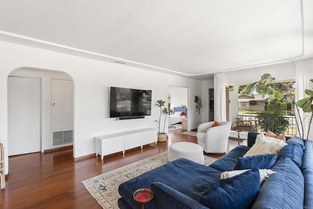 205 C St, Chula Vista, CA 91910 - living room featuring arched walkways and wood finished floors